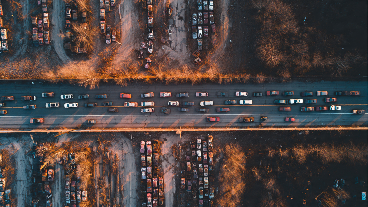 SUV fleet overtaking sedans on American highway with fatality rate overlay