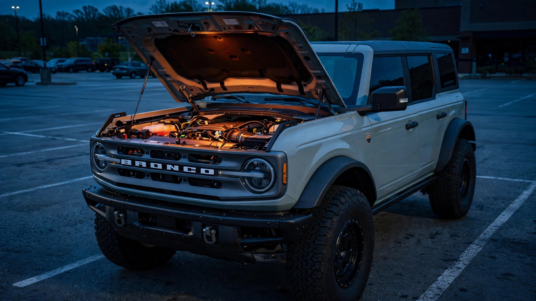 Ford Bronco with open hood showing engine compartment wiring
