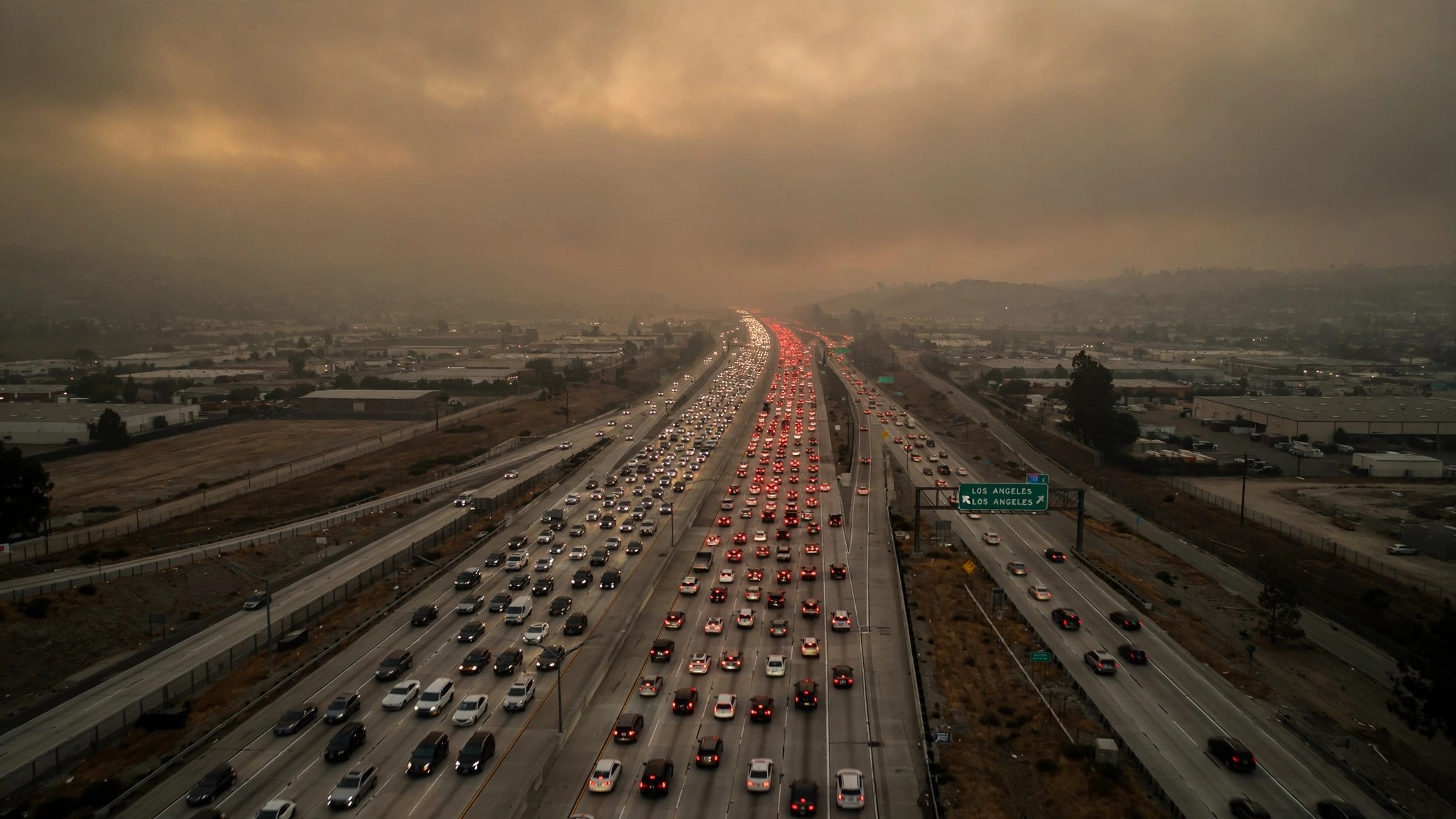 California freeway at dusk with brake lights
