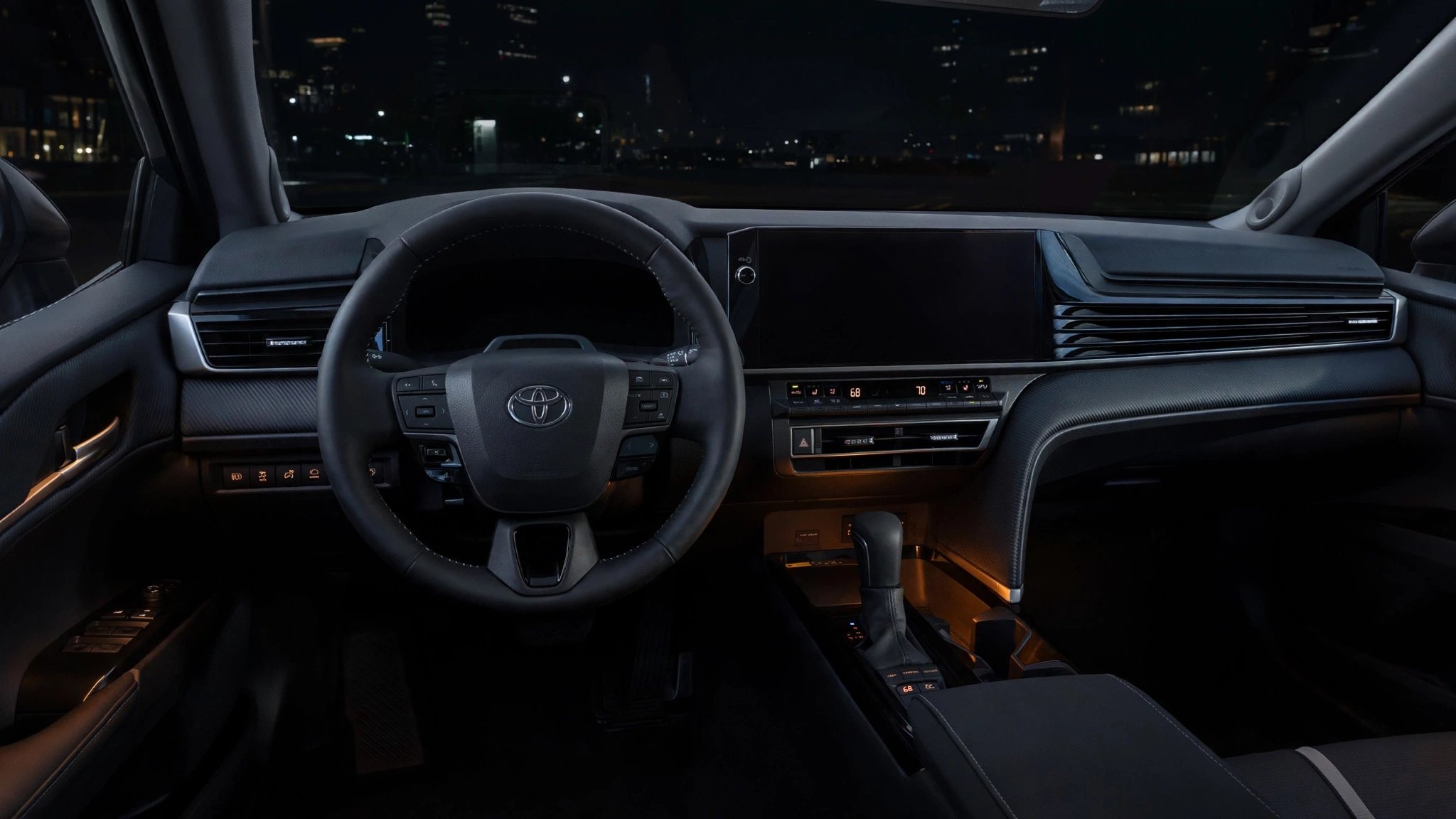 A 2025 Toyota Camry Hybrid dashboard with a completely blank instrument cluster at night