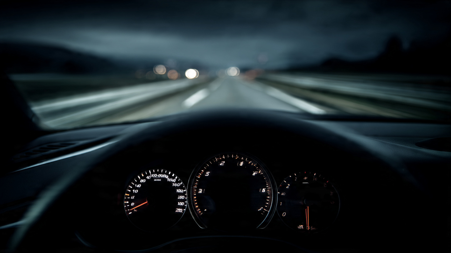 A car interior showing a completely black digital dashboard screen where instruments should be