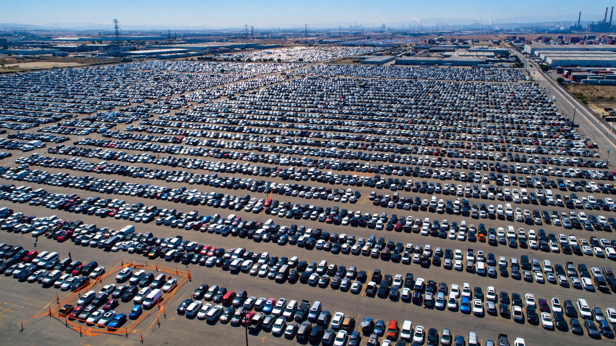 Aerial view of vast parking lot with only a tiny section cordoned off