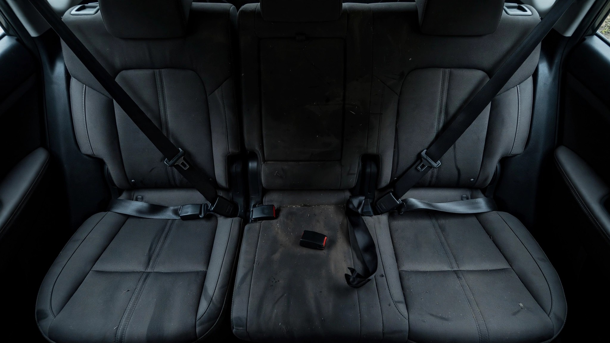 Empty rear center seat with seatbelt