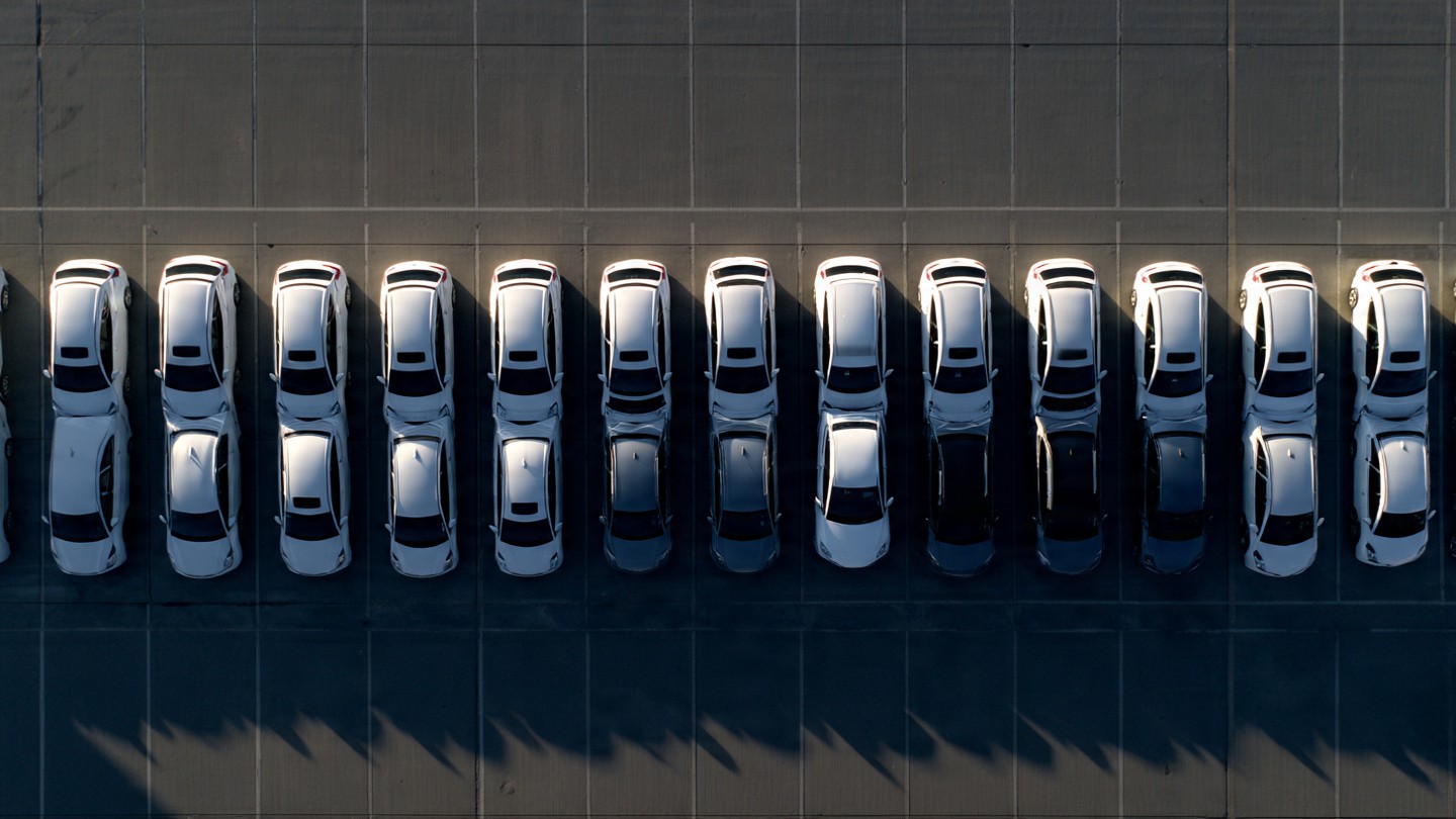 Rental car counter showing economy sedans versus compact SUVs with FARS death rates
