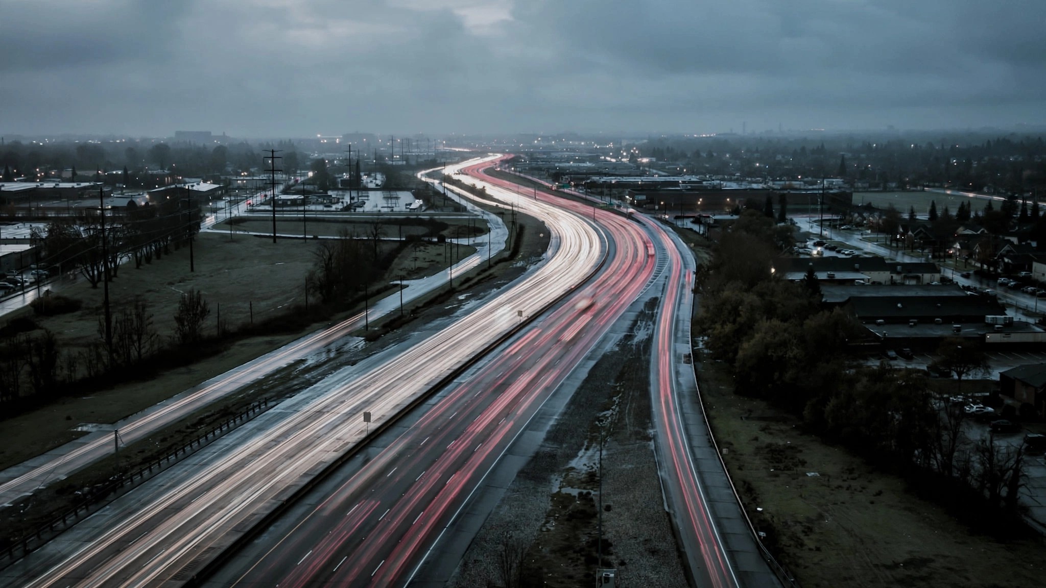 Empty six-lane American highway stretching to the horizon with a counter showing 23747 in red digits overlaid on the center line