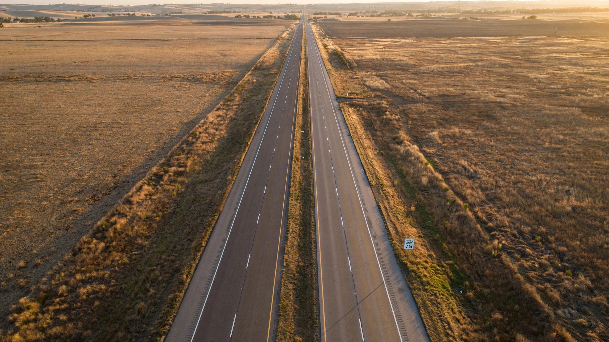 Rural interstate highway stretching to the horizon