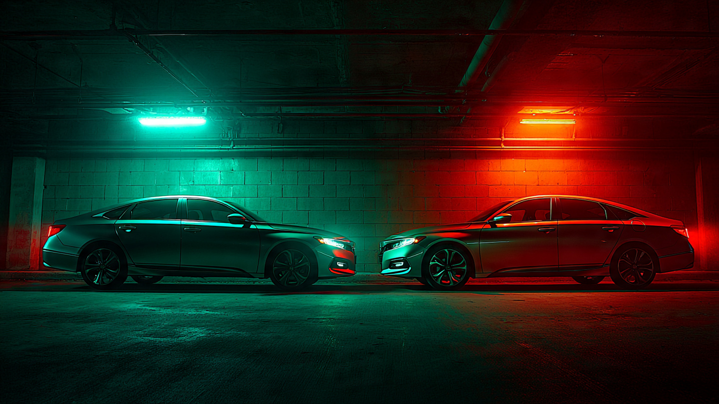 Two sedans in parking garage under contrasting green and red lights representing survival gap