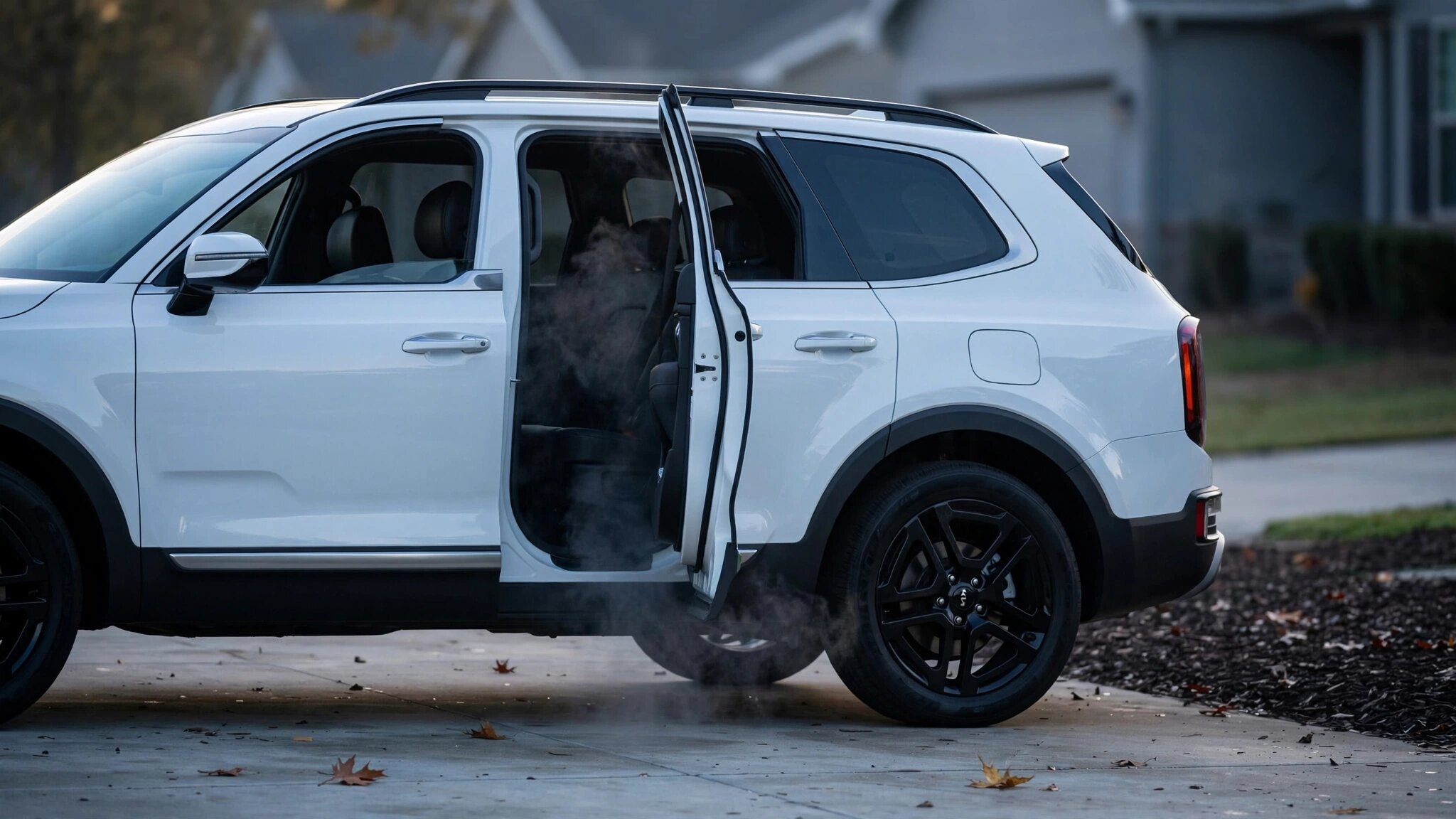 Kia Telluride SUV with split view: pristine safety rating on one side, glowing seat motor fire hazard on the other